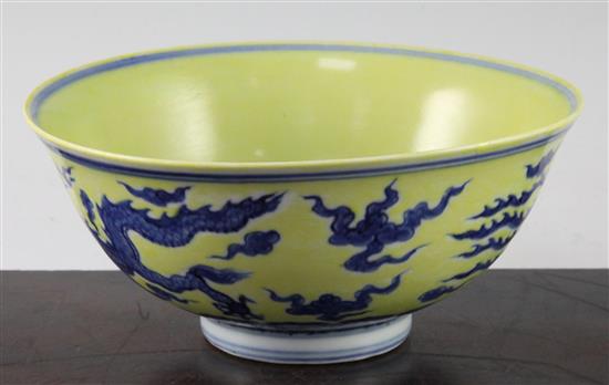 A Chinese yellow ground dragon and phoenix bowl, Xuande six character mark and possibly of the period, 19.5cm, museum restoration, sc